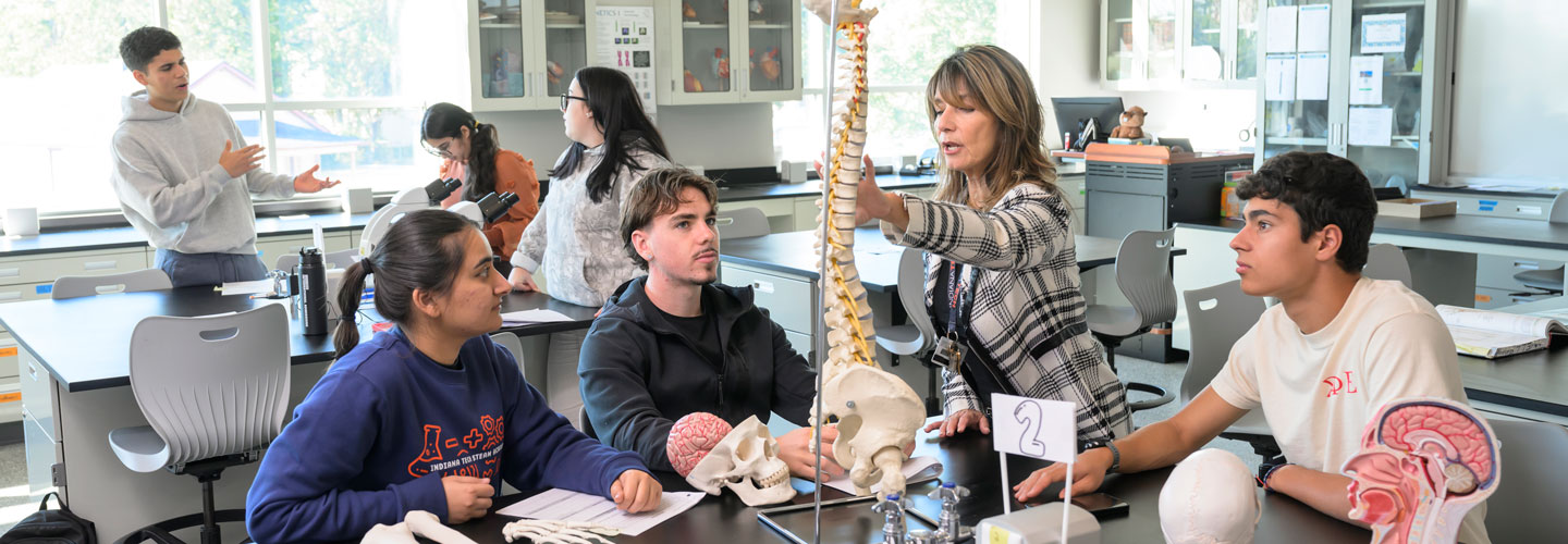 Dr. Sharon Drapala instructing students on a model spine